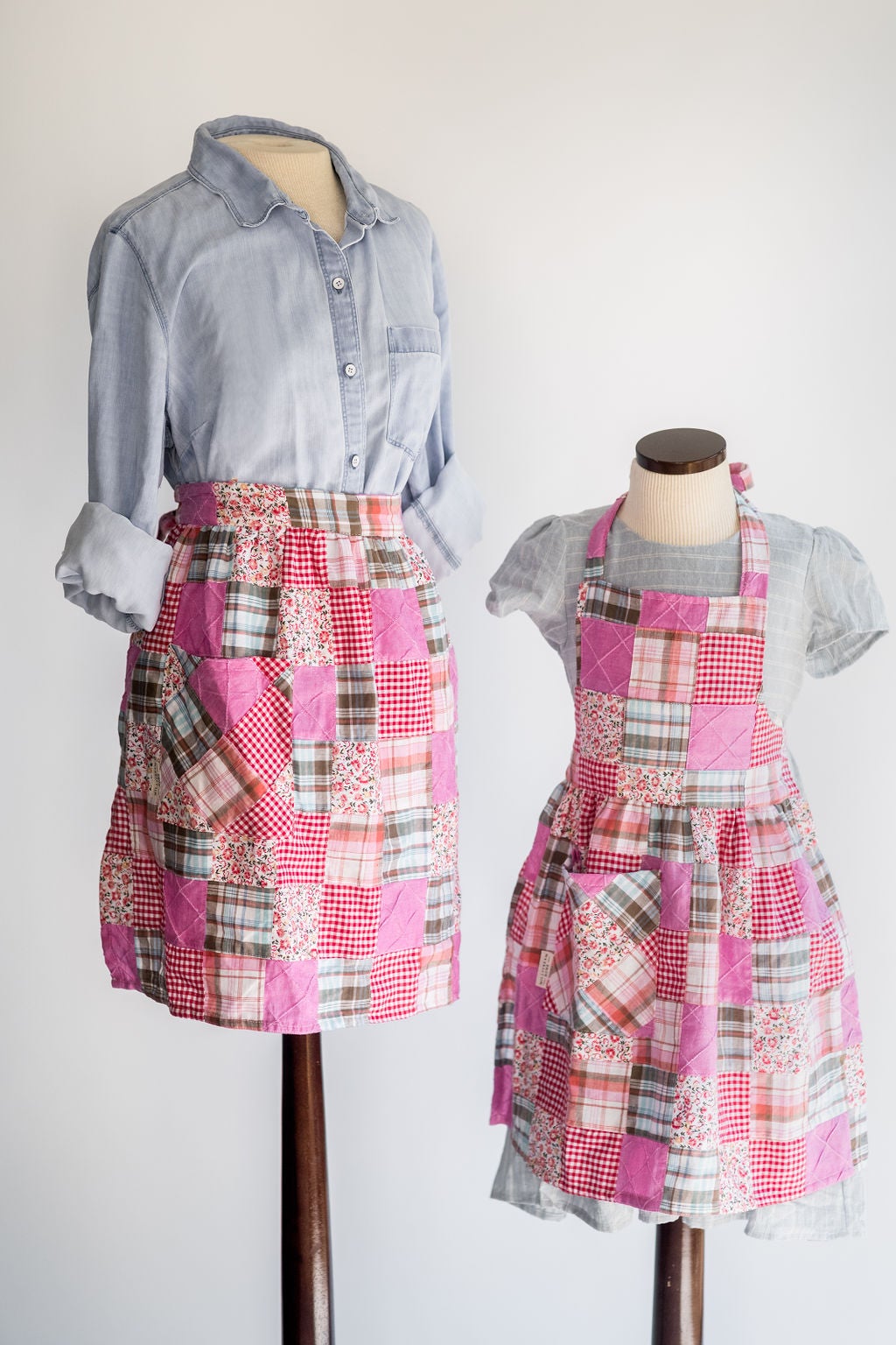 The Adult Quilted Patchwork Apron on a Mannequin