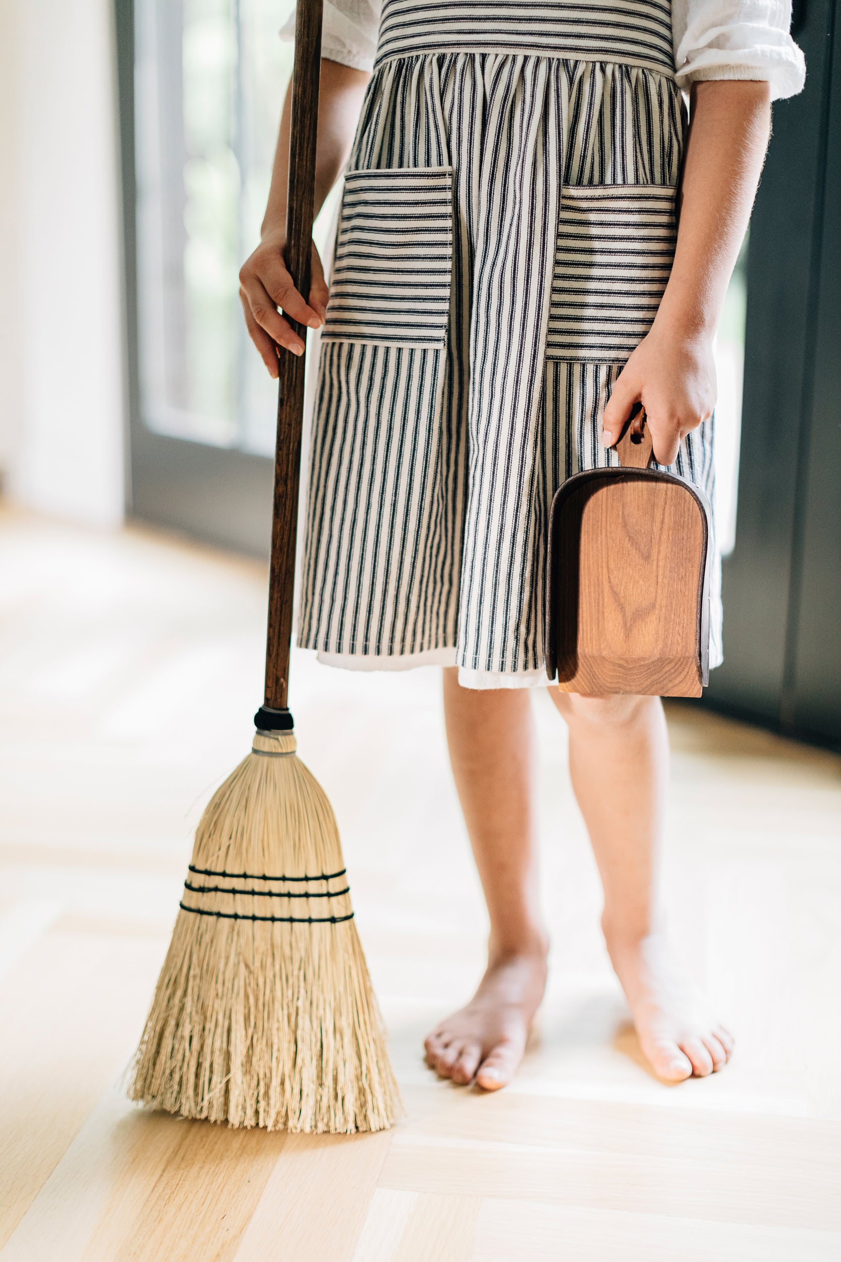 Child Holding the Child's Broom