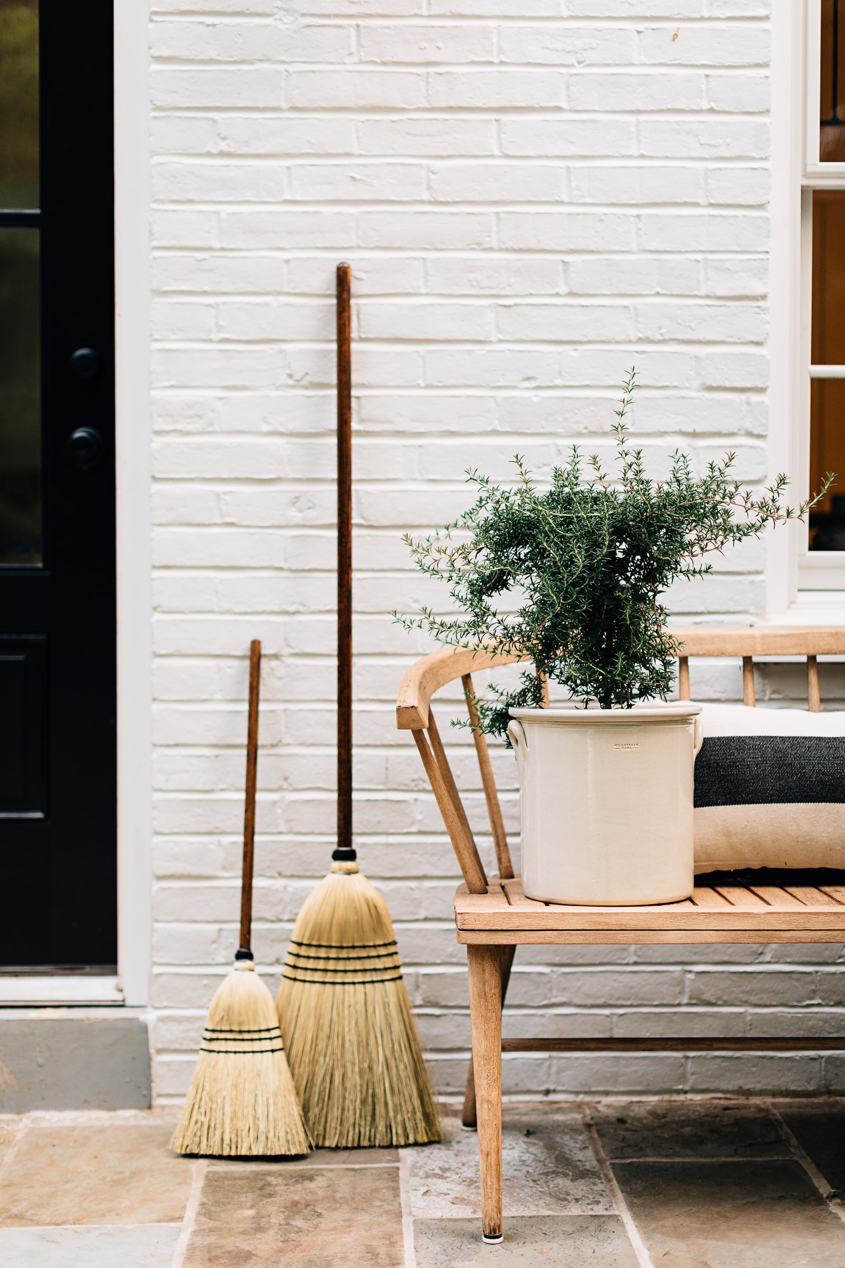 The Everyday Broom Leaning on a Wall