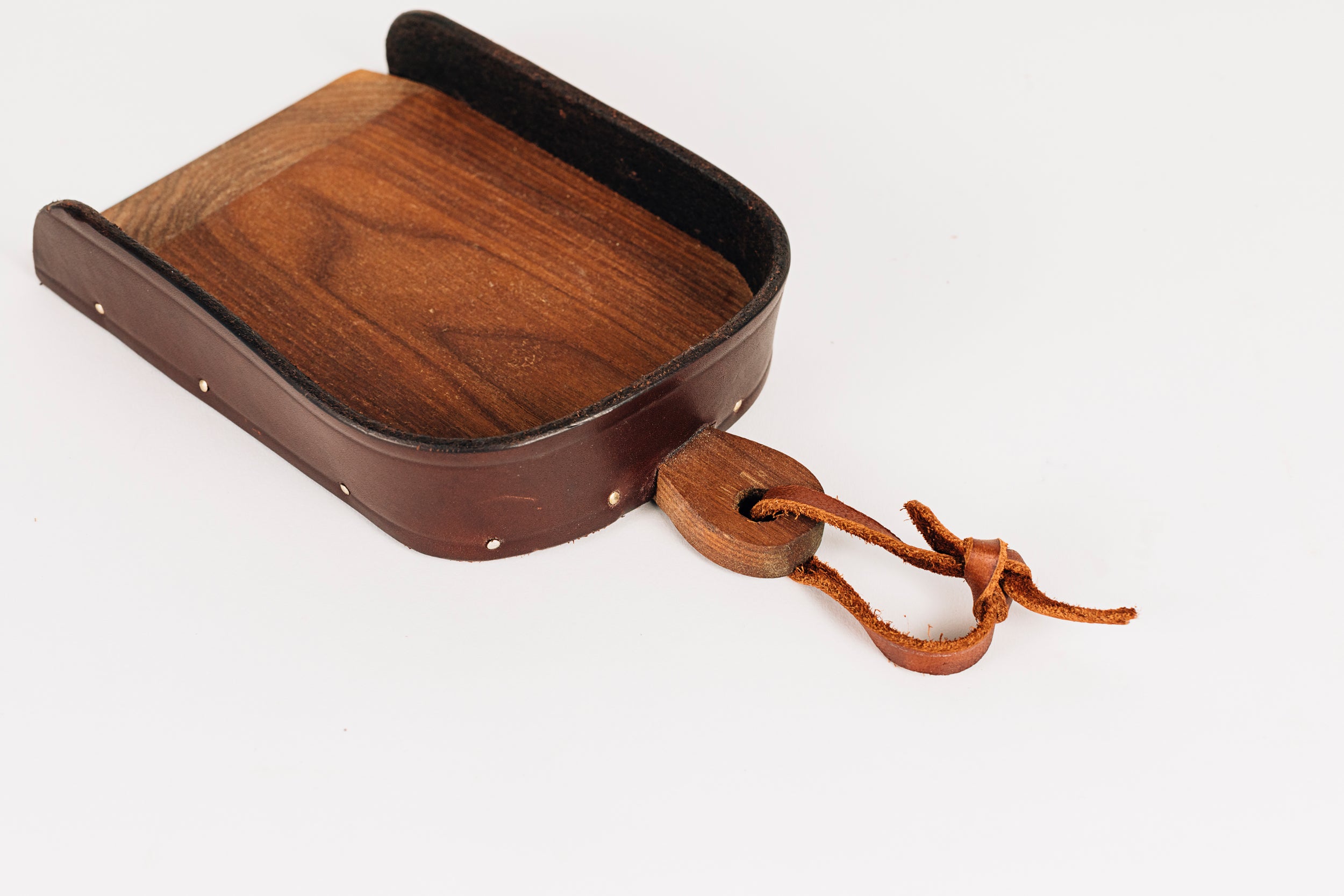 The Child's Leather and Wood Dustpan Up Close