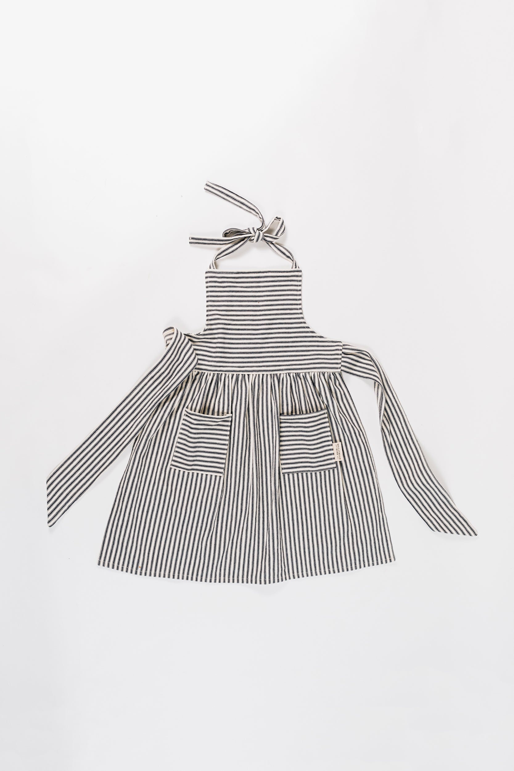 The Child's Ticking Apron